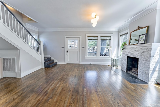 unfurnished living room featuring stairs, wood finished floors, visible vents, and ornamental molding