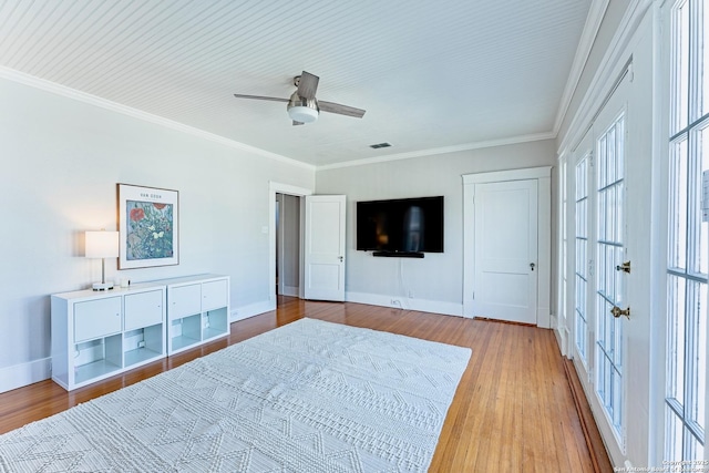 unfurnished bedroom with visible vents, crown molding, and wood finished floors