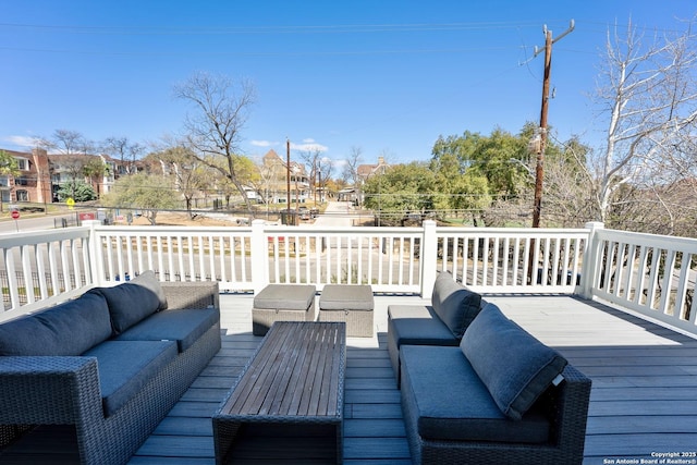 wooden deck featuring an outdoor living space