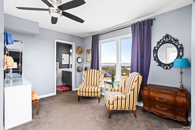 living area featuring baseboards, carpet floors, and ceiling fan