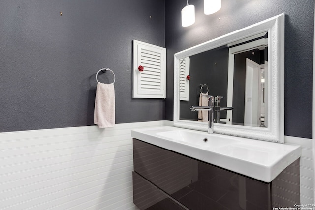 bathroom with a textured wall