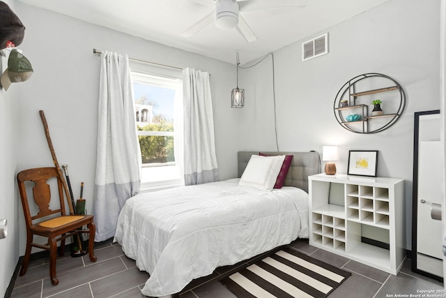 bedroom featuring visible vents and ceiling fan