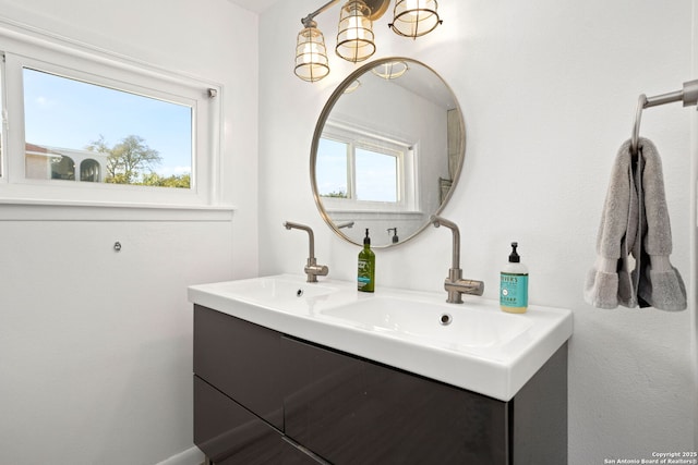 bathroom with double vanity and a sink