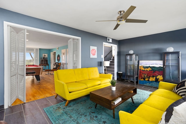 living area featuring billiards, a ceiling fan, visible vents, wood tiled floor, and stairs