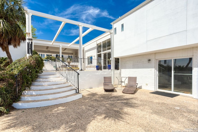 view of patio / terrace featuring a lanai