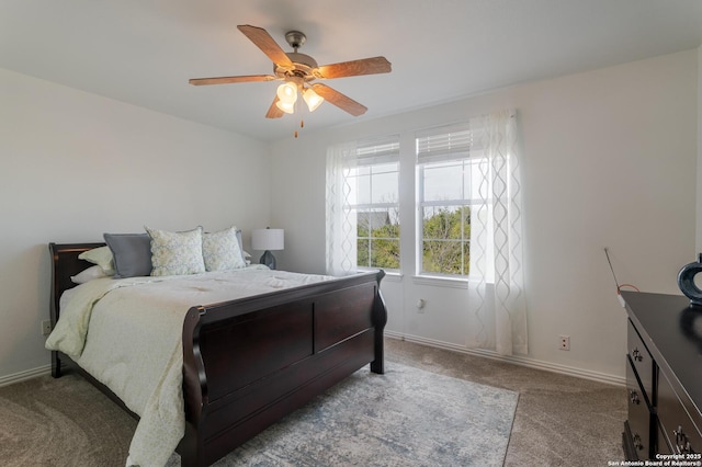 bedroom featuring baseboards, carpet, and a ceiling fan