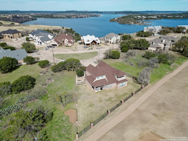 birds eye view of property featuring a residential view and a water view