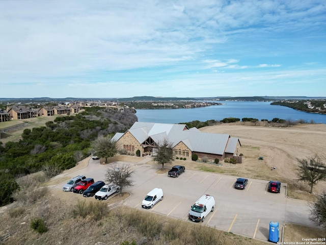 birds eye view of property with a water view