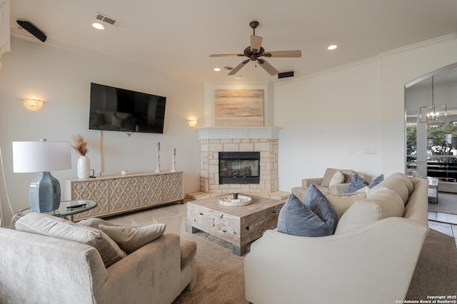 living area featuring visible vents, recessed lighting, arched walkways, ceiling fan, and crown molding