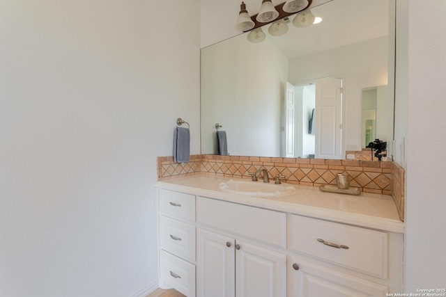 bathroom featuring backsplash and vanity