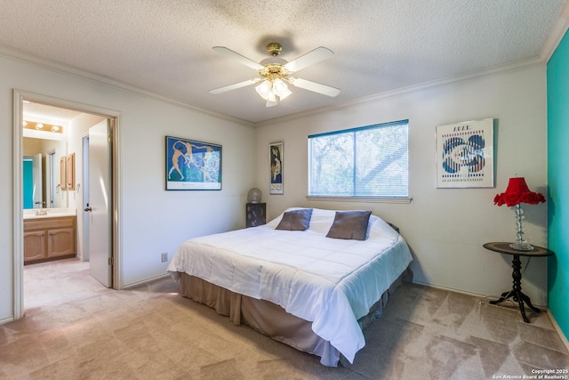 bedroom with ceiling fan, ensuite bathroom, a textured ceiling, crown molding, and light carpet