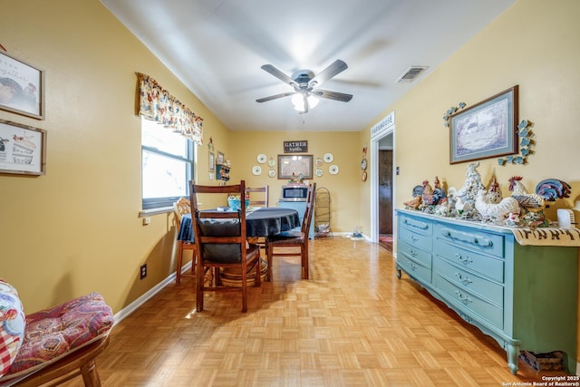 dining space featuring visible vents, baseboards, and ceiling fan