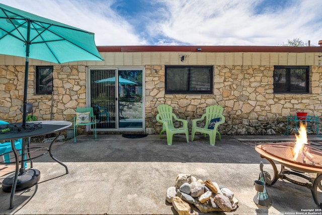 view of patio / terrace featuring a fire pit