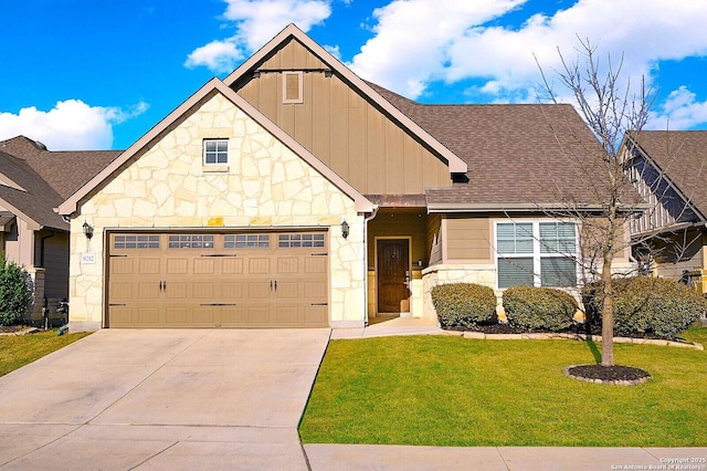 view of front facade with stone siding, driveway, board and batten siding, and a front yard