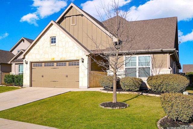 view of front of house with a front lawn, stone siding, board and batten siding, concrete driveway, and an attached garage