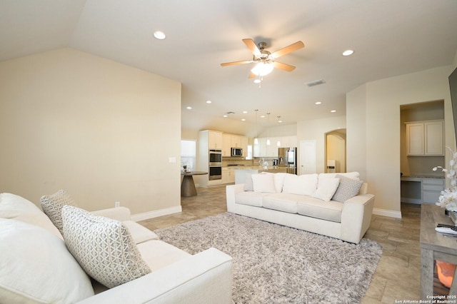 living area featuring a ceiling fan, visible vents, lofted ceiling, recessed lighting, and arched walkways