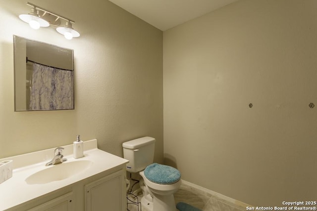 7326 Roveen, San Antonio, TX 78244 - bathroom featuring vanity, toilet, and baseboards