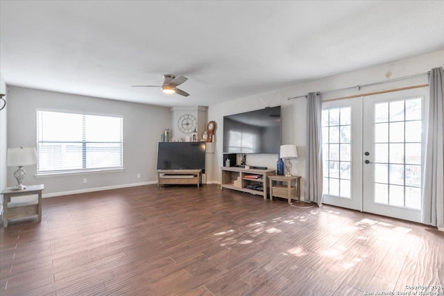 living room featuring french doors, baseboards, wood finished floors, and a ceiling fan