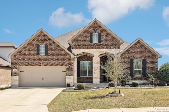 french country inspired facade featuring stone siding, brick siding, concrete driveway, and a front lawn