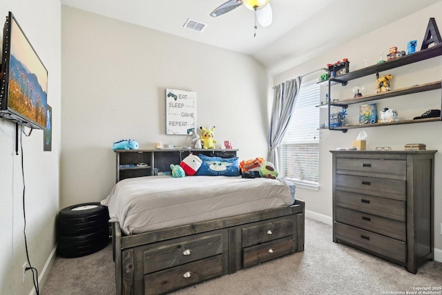 bedroom featuring visible vents, a ceiling fan, baseboards, light colored carpet, and vaulted ceiling