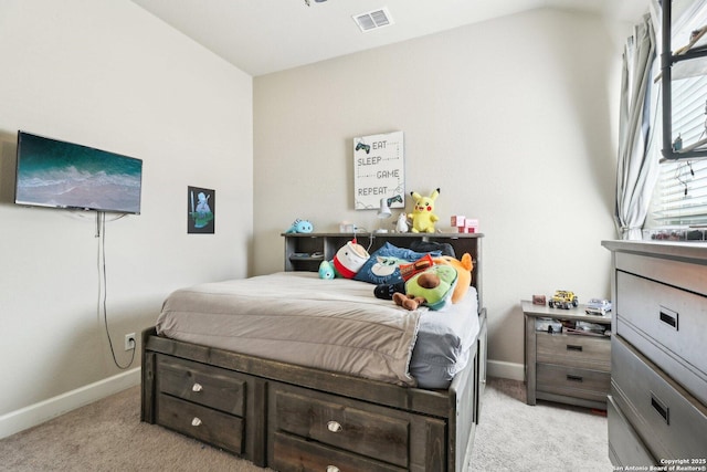 bedroom featuring baseboards, visible vents, and light carpet