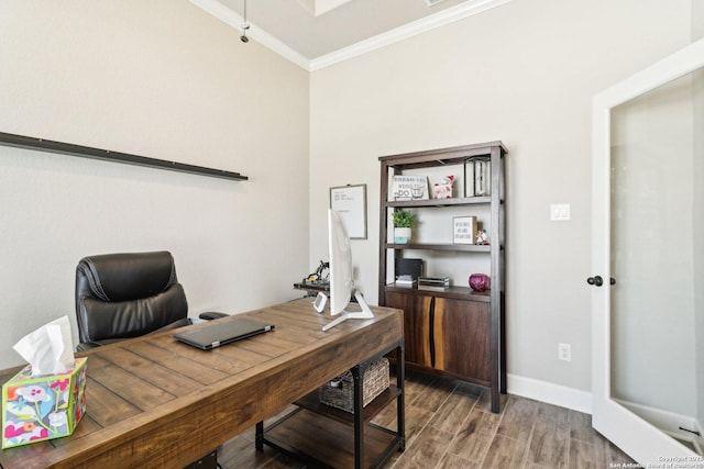 office space with crown molding, baseboards, and wood finished floors