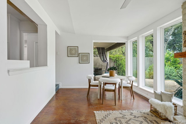 sunroom featuring a ceiling fan