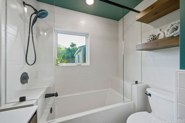 bathroom with bathing tub / shower combination and toilet