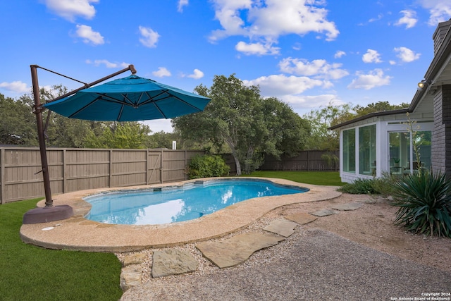 view of pool featuring a fenced in pool and a fenced backyard