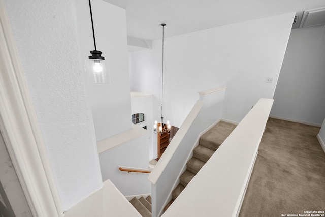 stairway with carpet and baseboards