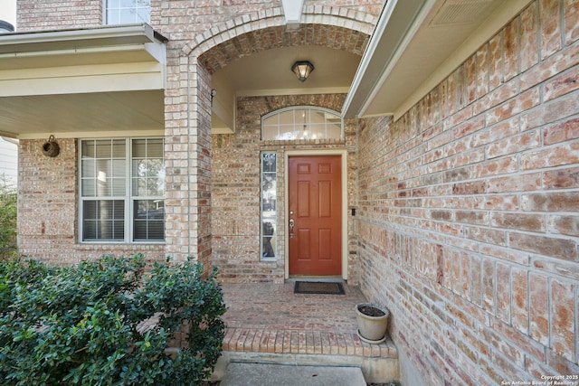 entrance to property with brick siding