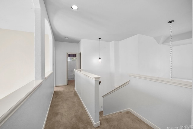 hall featuring recessed lighting, baseboards, an upstairs landing, and carpet flooring