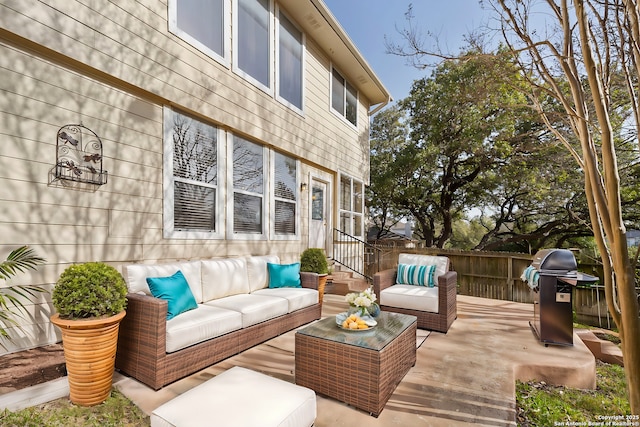 wooden terrace with outdoor lounge area and area for grilling