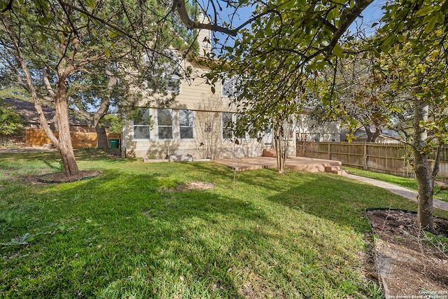 view of yard featuring a patio area and a fenced backyard