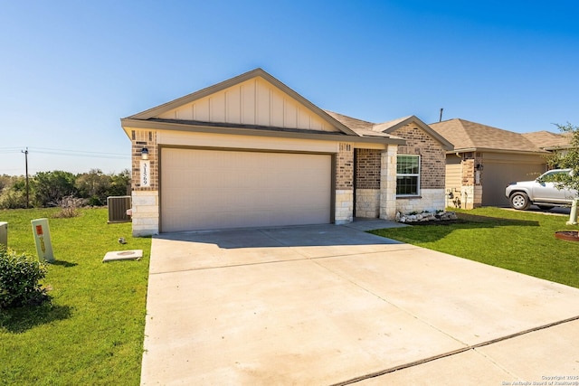 ranch-style house featuring a front yard, driveway, an attached garage, central air condition unit, and board and batten siding