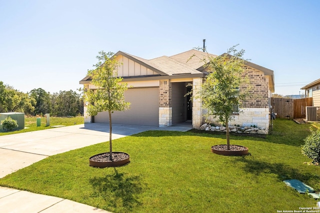 view of front of home with driveway, stone siding, board and batten siding, a front yard, and an attached garage