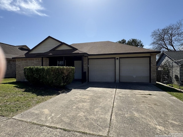 single story home featuring a garage, brick siding, roof with shingles, and concrete driveway