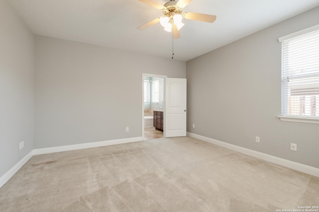 12535 Quarter J, San Antonio, TX 78254 - empty room with light carpet, baseboards, and a ceiling fan