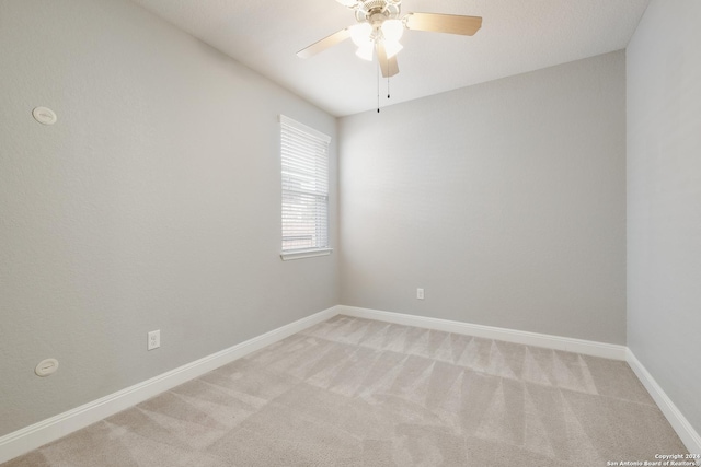 12535 Quarter J, San Antonio, TX 78254 - unfurnished room featuring light carpet, baseboards, and ceiling fan
