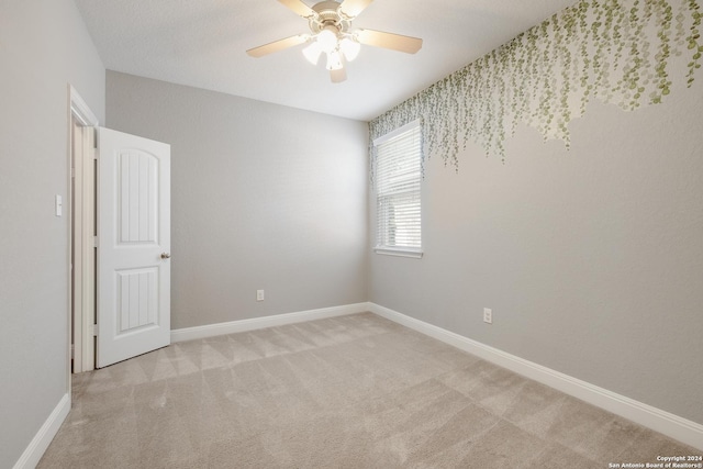 12535 Quarter J, San Antonio, TX 78254 - spare room featuring baseboards, light colored carpet, and a ceiling fan