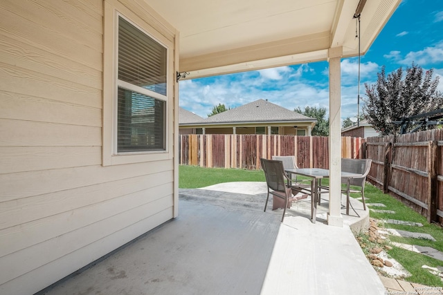 12535 Quarter J, San Antonio, TX 78254 - view of patio / terrace featuring outdoor dining space and fence