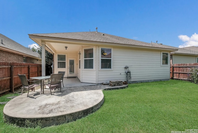 12535 Quarter J, San Antonio, TX 78254 - back of property with a yard, a patio, and a fenced backyard