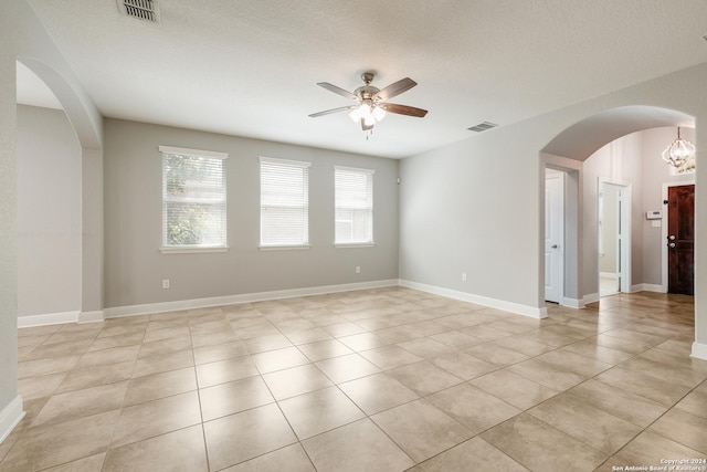 12535 Quarter J, San Antonio, TX 78254 - unfurnished room with arched walkways, visible vents, baseboards, and ceiling fan