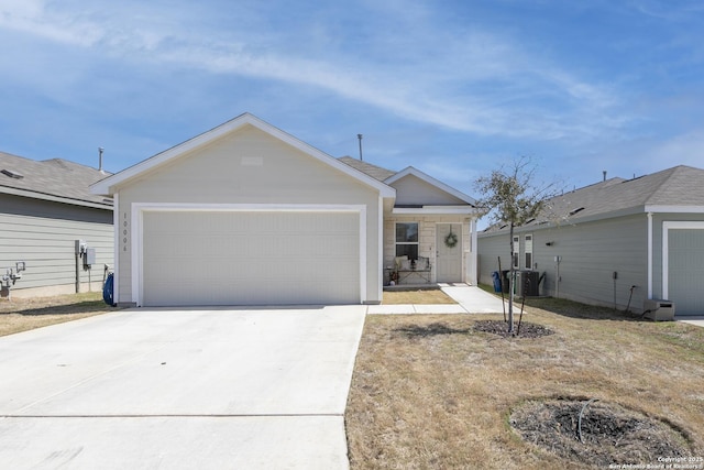 ranch-style house featuring cooling unit, concrete driveway, and a garage