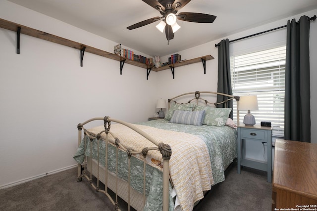 bedroom featuring a ceiling fan and carpet