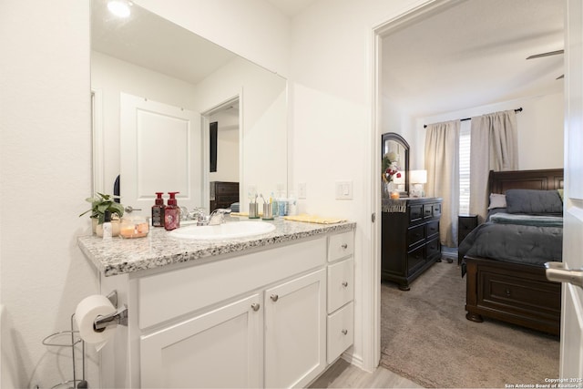 bathroom featuring vanity and ensuite bathroom