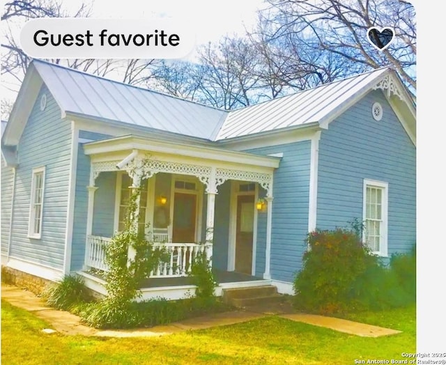 view of front of home featuring a porch, metal roof, and a standing seam roof