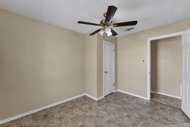 unfurnished bedroom featuring visible vents, ceiling fan, and baseboards