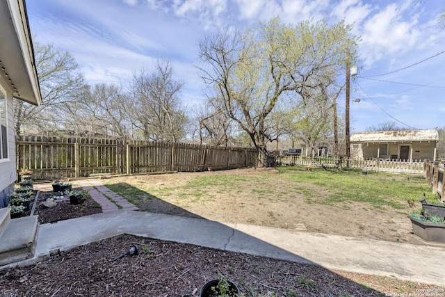 view of yard with a fenced backyard