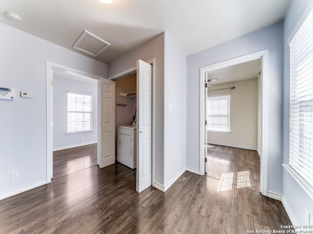 washroom with laundry area, a healthy amount of sunlight, washer / clothes dryer, and wood finished floors